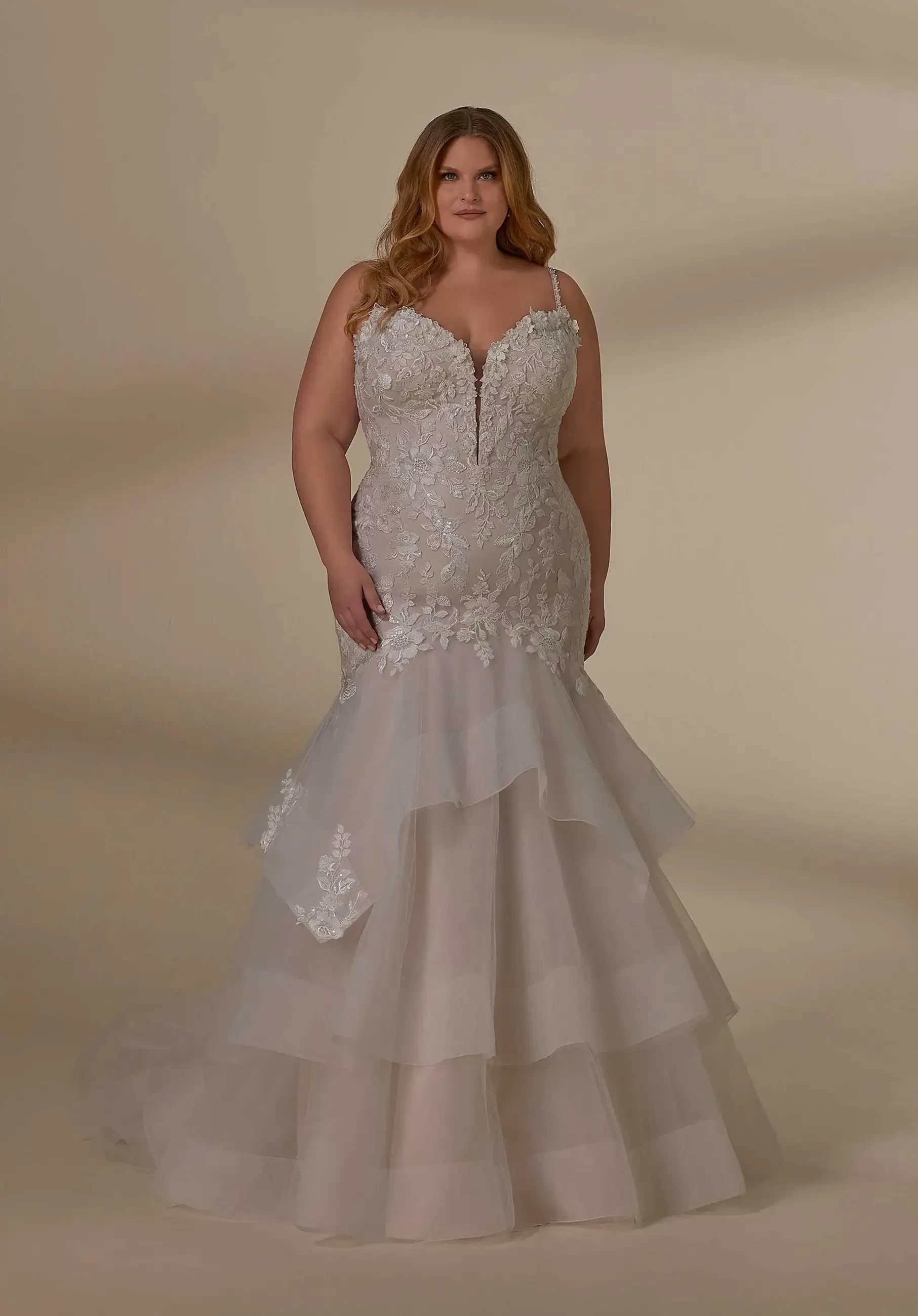 model is wearing a sleeveless mermaid bridal gown